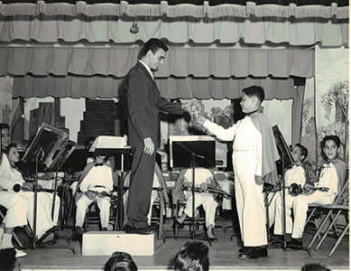 Photo of James Leone receiving a gift from a student