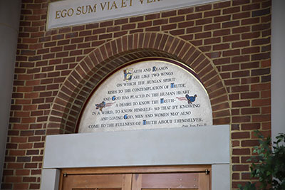 Pope Saint John Paul II’s words defending the unity of faith and reason grace the entrance to our library.